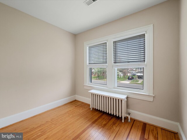 675 National Ave, Winchester, VA 22601 - unfurnished room with visible vents, light wood-type flooring, baseboards, and radiator