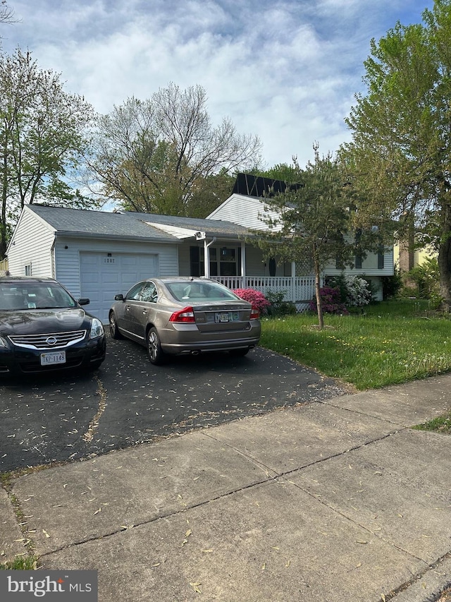 1207 Sunrise Ct, Herndon, VA 20170 - view of front of property with driveway, a garage, a front yard, and a porch