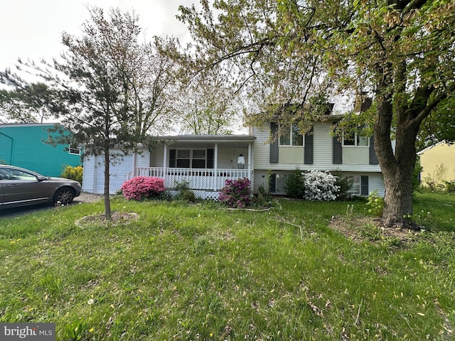 1207 Sunrise Ct, Herndon, VA 20170 - split level home with a porch, a garage, and a front yard