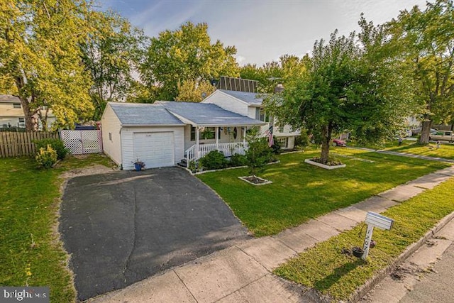 1207 Sunrise Ct, Herndon, VA 20170 - view of front of house with covered porch, asphalt driveway, and a garage