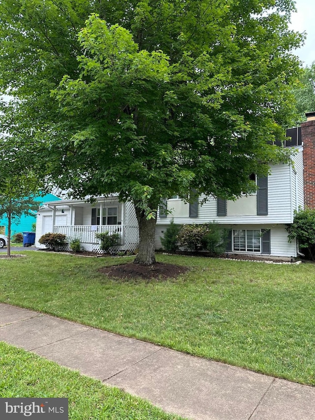 1207 Sunrise Ct, Herndon, VA 20170 - view of front of property featuring a front lawn, a garage, and covered porch