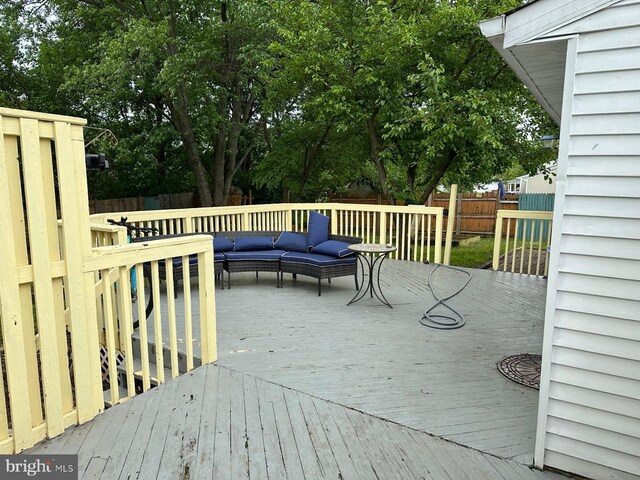 1207 Sunrise Ct, Herndon, VA 20170 - wooden deck featuring a fenced backyard and outdoor lounge area