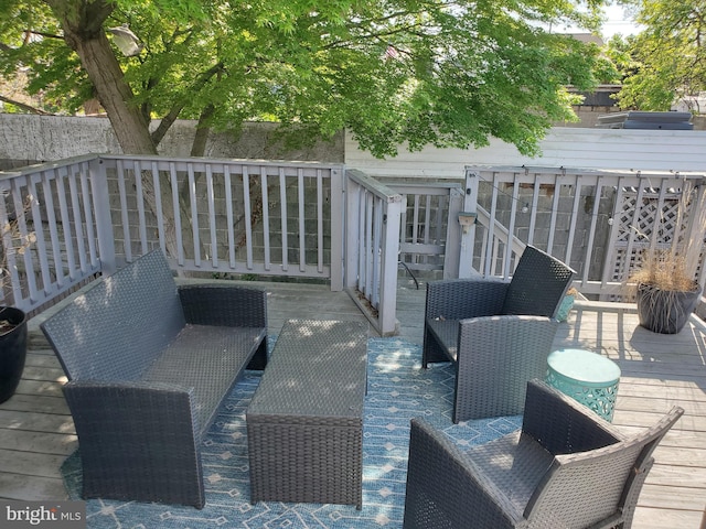 wooden deck featuring an outdoor living space