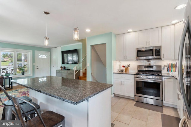 25 Haddington Rd, Lutherville Timonium, MD 21093 - kitchen featuring a kitchen breakfast bar, dark stone counters, white cabinets, tasteful backsplash, and stainless steel appliances