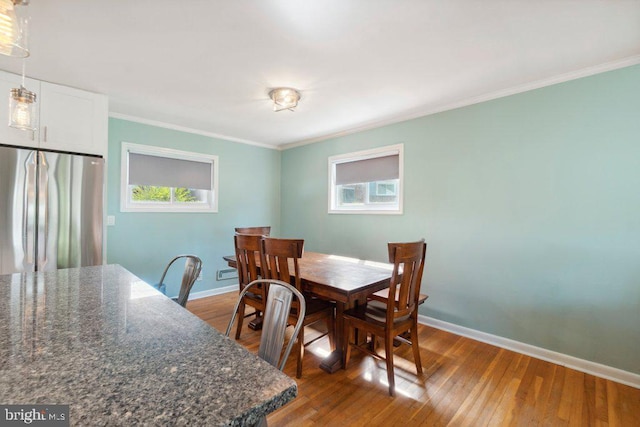 25 Haddington Rd, Lutherville Timonium, MD 21093 - dining space featuring crown molding, baseboards, and dark wood finished floors