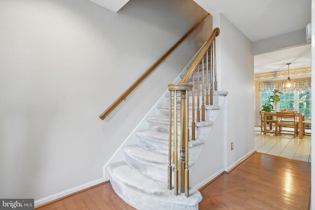 1728 Catherine Fran Dr, Accokeek, MD 20607 - staircase featuring hardwood / wood-style floors and baseboards