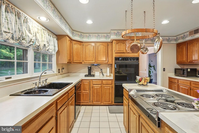 1728 Catherine Fran Dr, Accokeek, MD 20607 - kitchen with light tile patterned floors, a sink, visible vents, light countertops, and black appliances