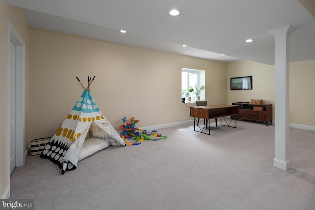 recreation room with recessed lighting, baseboards, light colored carpet, and decorative columns