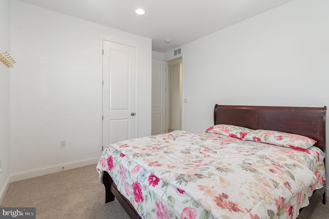 carpeted bedroom featuring baseboards, visible vents, and recessed lighting
