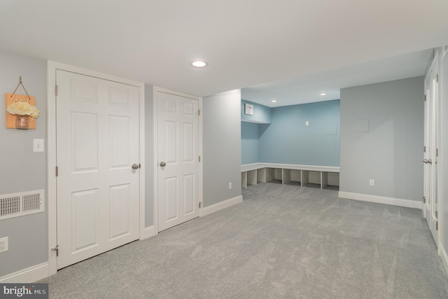 interior space featuring baseboards, carpet flooring, and recessed lighting