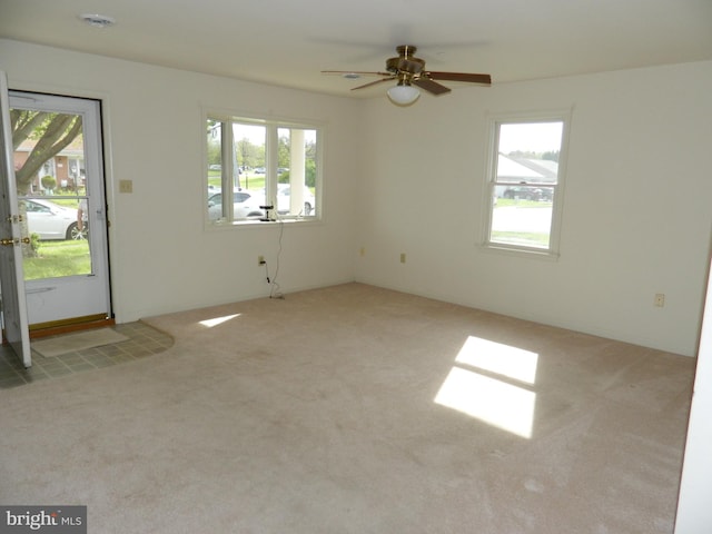 interior space featuring a ceiling fan and a healthy amount of sunlight