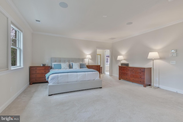carpeted bedroom with baseboards, crown molding, and visible vents