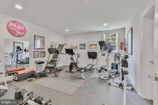 workout area featuring recessed lighting and baseboards
