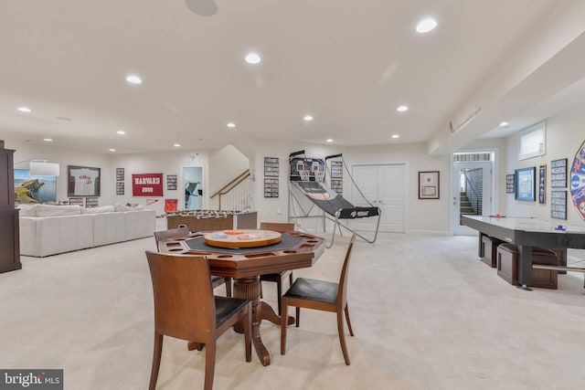 dining space featuring light carpet and recessed lighting