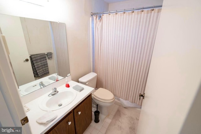 full bath featuring vanity, a shower with shower curtain, tile patterned flooring, and toilet