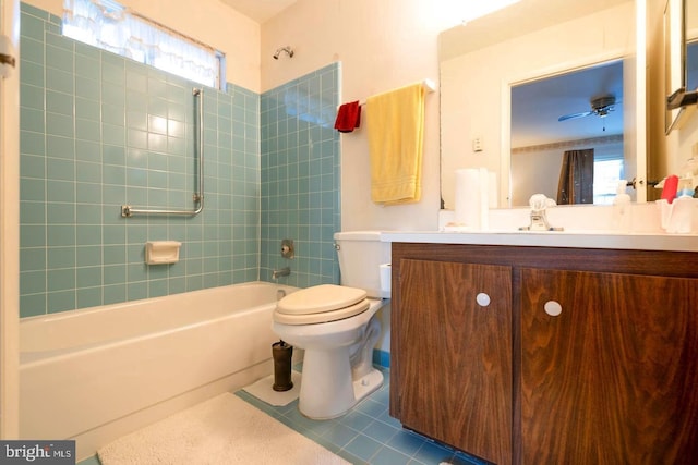 bathroom featuring shower / bathing tub combination, ceiling fan, vanity, tile patterned floors, and toilet
