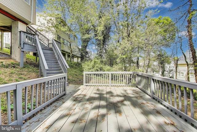 wooden terrace featuring stairs