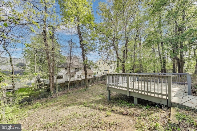view of yard with a deck and a residential view