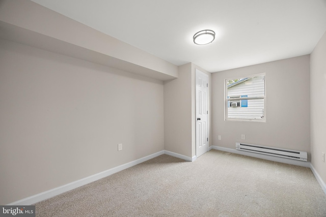 unfurnished room featuring baseboards, carpet flooring, and baseboard heating