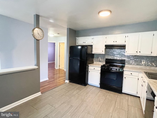 kitchen with backsplash, black appliances, light countertops, white cabinets, and wood finish floors