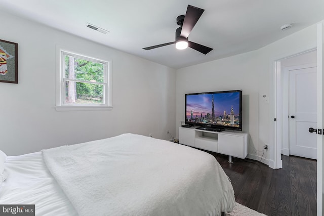 bedroom featuring dark wood finished floors and ceiling fan