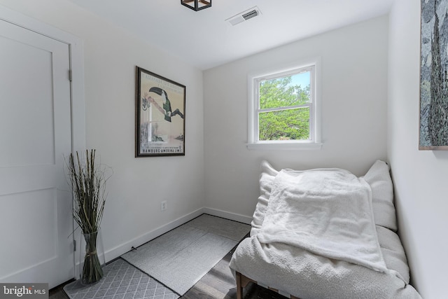 living area featuring baseboards