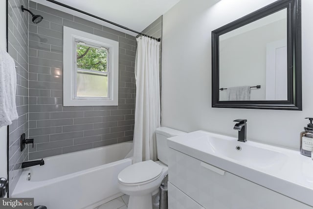 bathroom featuring toilet, shower / bath combination with curtain, and vanity