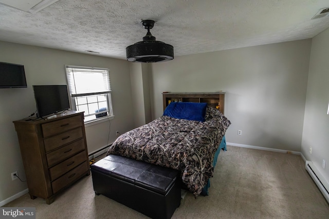 bedroom featuring a baseboard radiator, baseboard heating, baseboards, visible vents, and light carpet