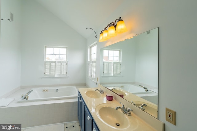 full bathroom with a garden tub, a sink, vaulted ceiling, and double vanity