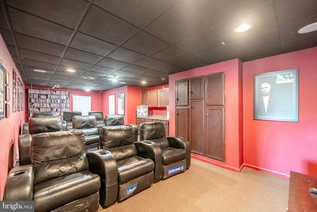 cinema room with light colored carpet, a drop ceiling, and recessed lighting