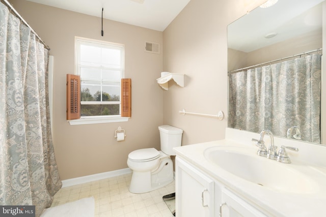 full bathroom with baseboards, toilet, vanity, and visible vents
