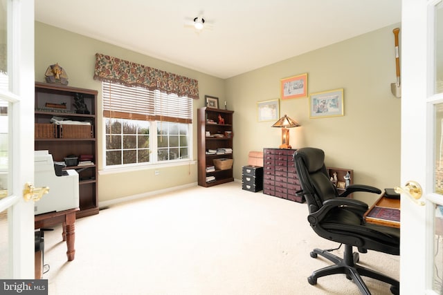office space featuring baseboards and carpet