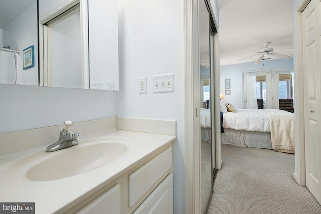 ensuite bathroom featuring ceiling fan, vanity, and ensuite bathroom