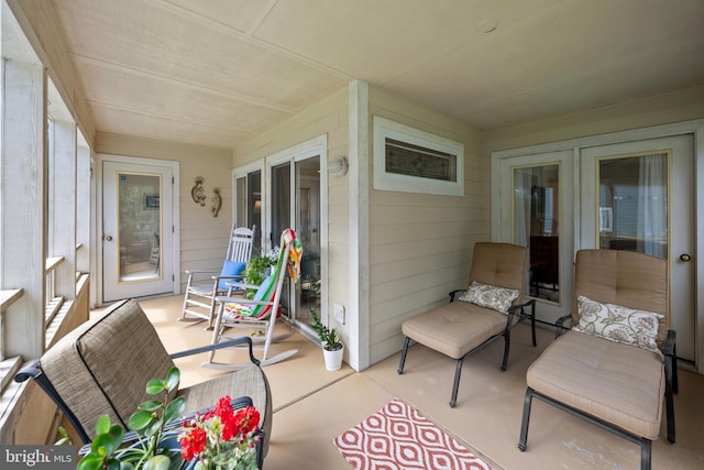 sunroom featuring french doors