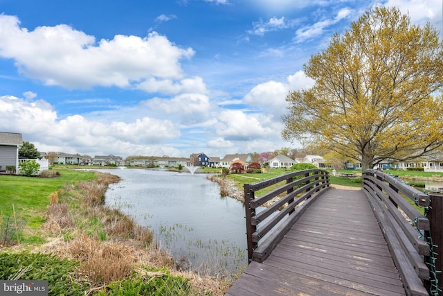 dock area with a water view and a residential view