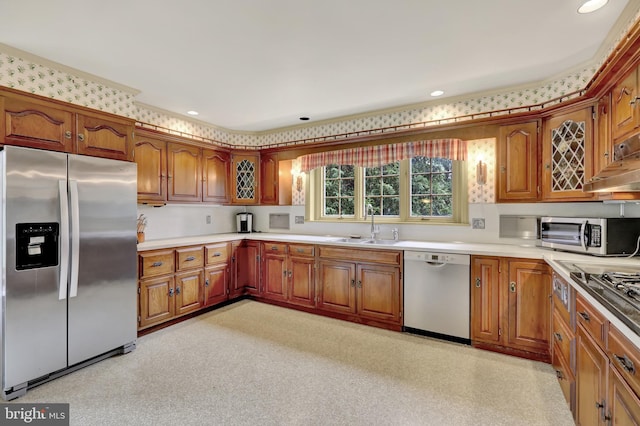 237 Endlich Ave, Reading, PA 19606 - kitchen with stainless steel appliances, brown cabinetry, light countertops, and recessed lighting