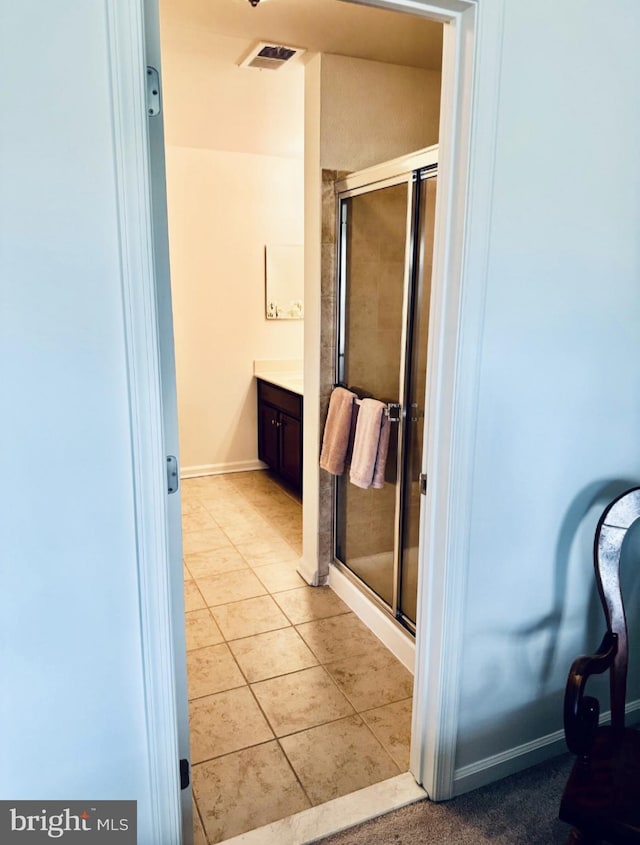 12 Canal Xing Unit 228, Burlington Township, NJ 08016 - full bath with a stall shower, vanity, tile patterned flooring, and baseboards