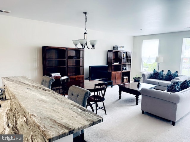 12 Canal Xing Unit 228, Burlington Township, NJ 08016 - living room with light carpet and a chandelier