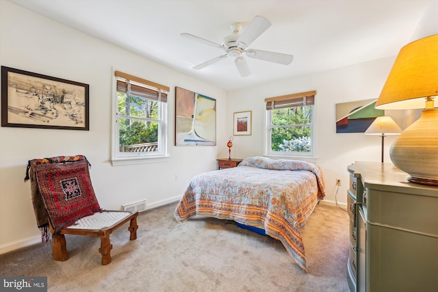 bedroom featuring baseboards, visible vents, carpet floors, and ceiling fan