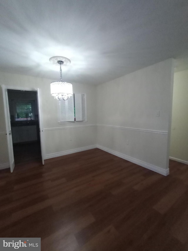12724 Inverness Way, Woodbridge, VA 22192 - unfurnished dining area featuring a chandelier and dark wood finished floors