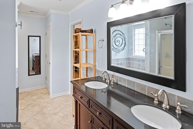 full bath with a shower with shower door, visible vents, ornamental molding, and a sink