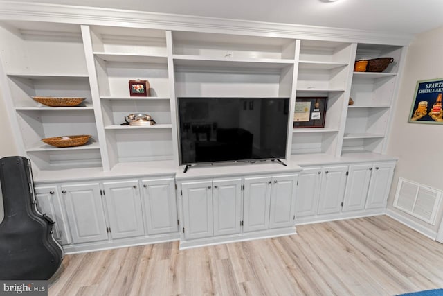 living room with visible vents and light wood finished floors