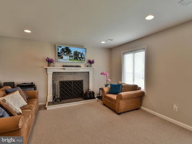 8362 Inspiration Ave, Walkersville, MD 21793 - carpeted living room featuring recessed lighting, a tiled fireplace, visible vents, and baseboards