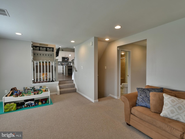8362 Inspiration Ave, Walkersville, MD 21793 - carpeted living room with baseboards, visible vents, recessed lighting, and stairs
