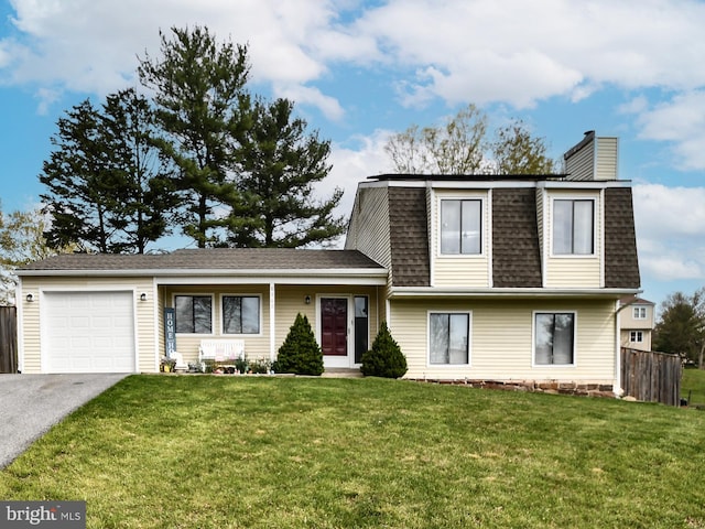 8362 Inspiration Ave, Walkersville, MD 21793 - view of front of home featuring a front lawn, driveway, fence, an attached garage, and a shingled roof