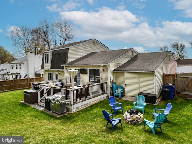 8362 Inspiration Ave, Walkersville, MD 21793 - rear view of property with a fenced backyard, a wooden deck, an outdoor living space with a fire pit, a lawn, and roof with shingles