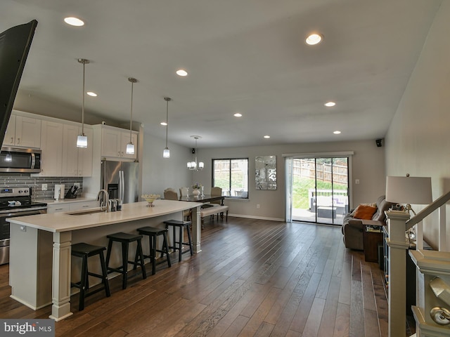 8362 Inspiration Ave, Walkersville, MD 21793 - kitchen with a sink, open floor plan, light countertops, appliances with stainless steel finishes, and dark wood-style floors