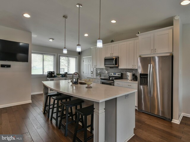 8362 Inspiration Ave, Walkersville, MD 21793 - kitchen featuring an island with sink, appliances with stainless steel finishes, baseboards, and dark wood-style flooring