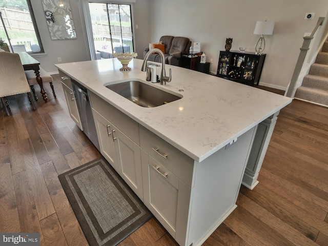 8362 Inspiration Ave, Walkersville, MD 21793 - kitchen featuring a sink, a healthy amount of sunlight, dark wood-style flooring, light stone countertops, and dishwasher