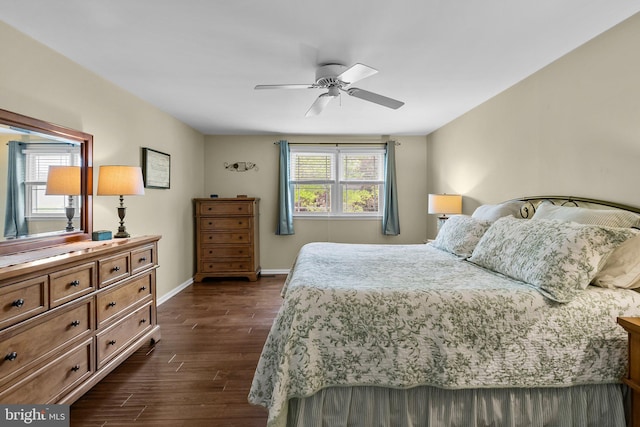 bedroom with dark wood finished floors, baseboards, and a ceiling fan